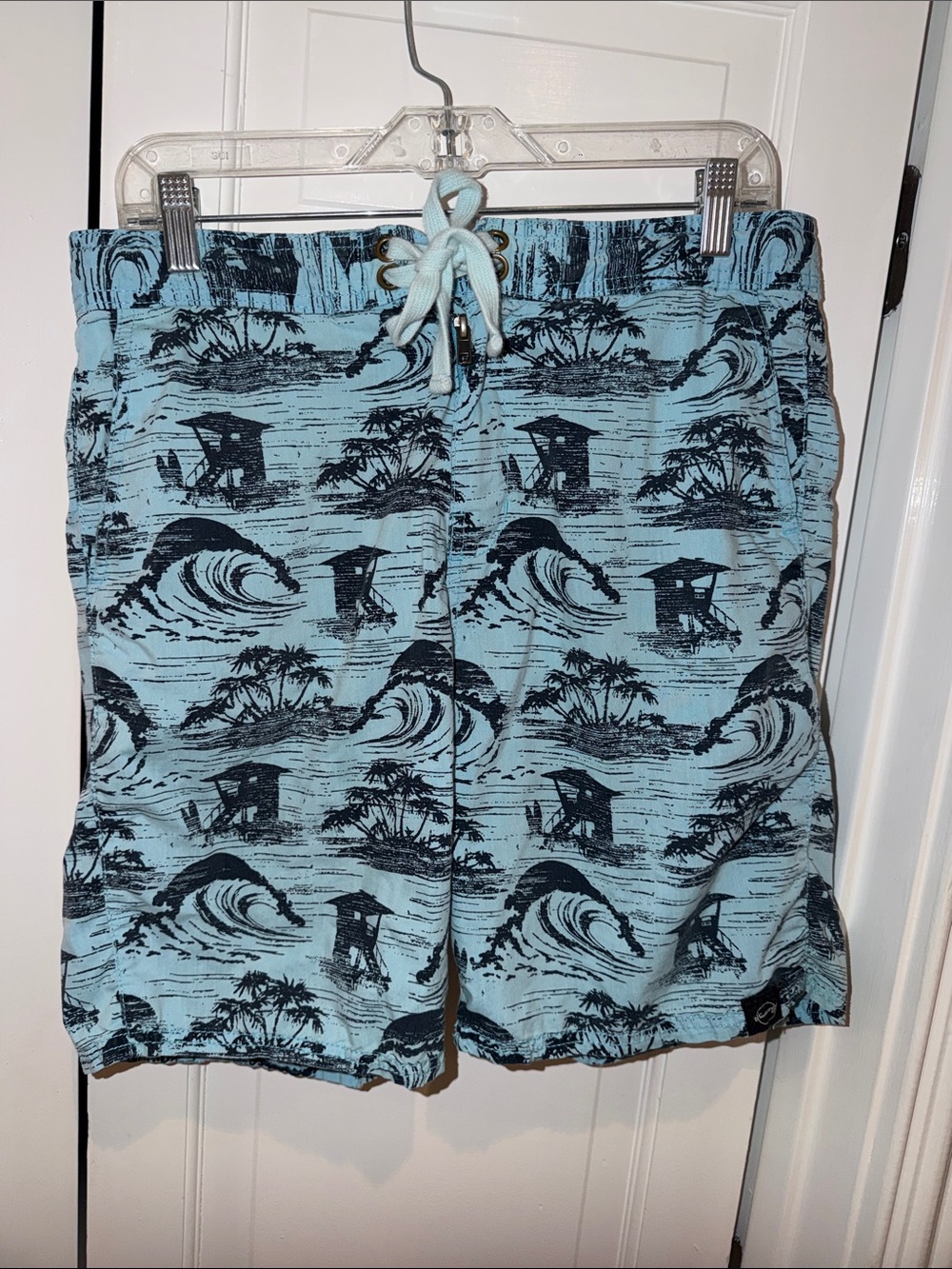 Weatherproof Light Blue and Black Tropical Wave Swim Trunks